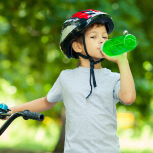 Boy on bike with water bottle